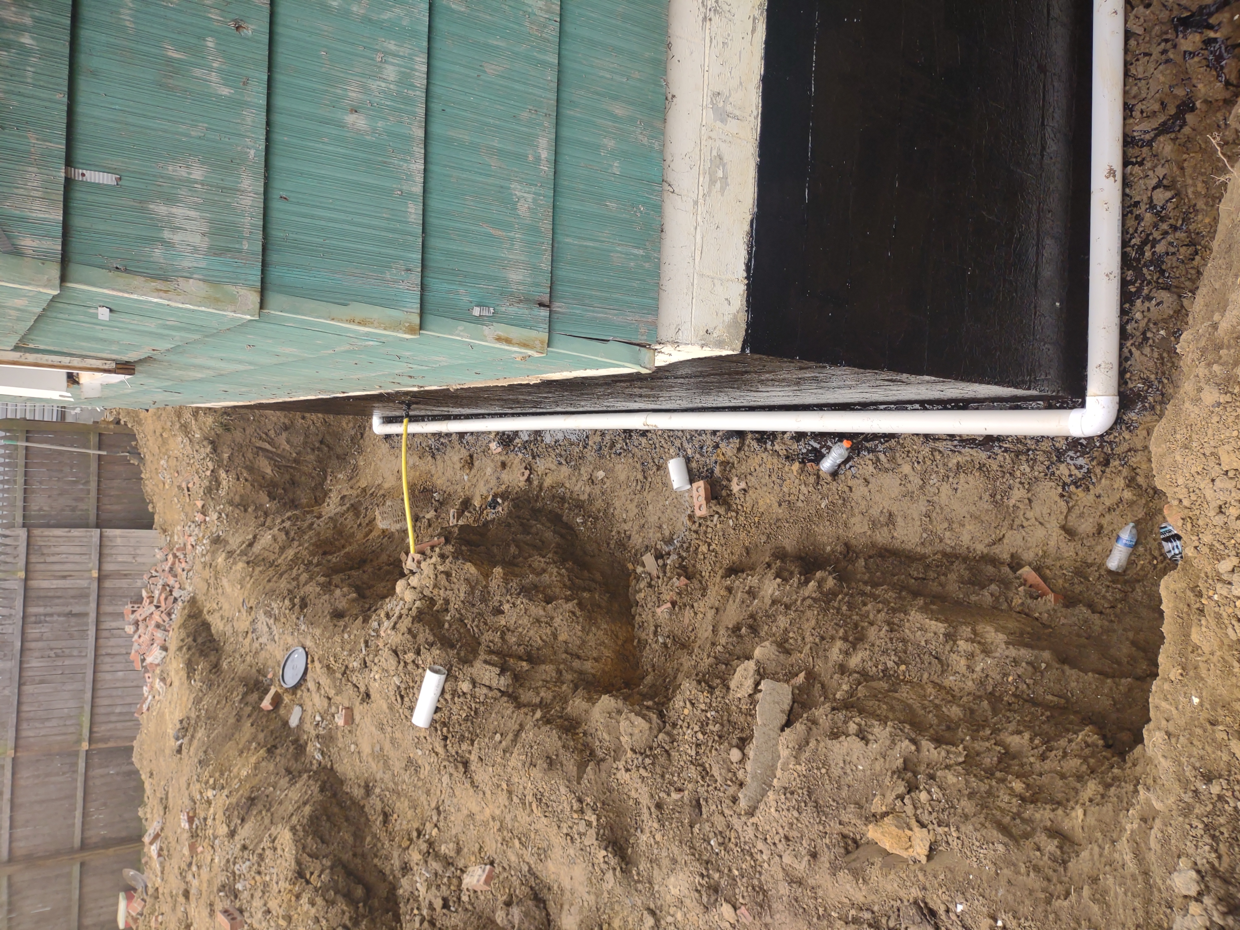 Waterproofing membrane applied to foundation wall close-up
