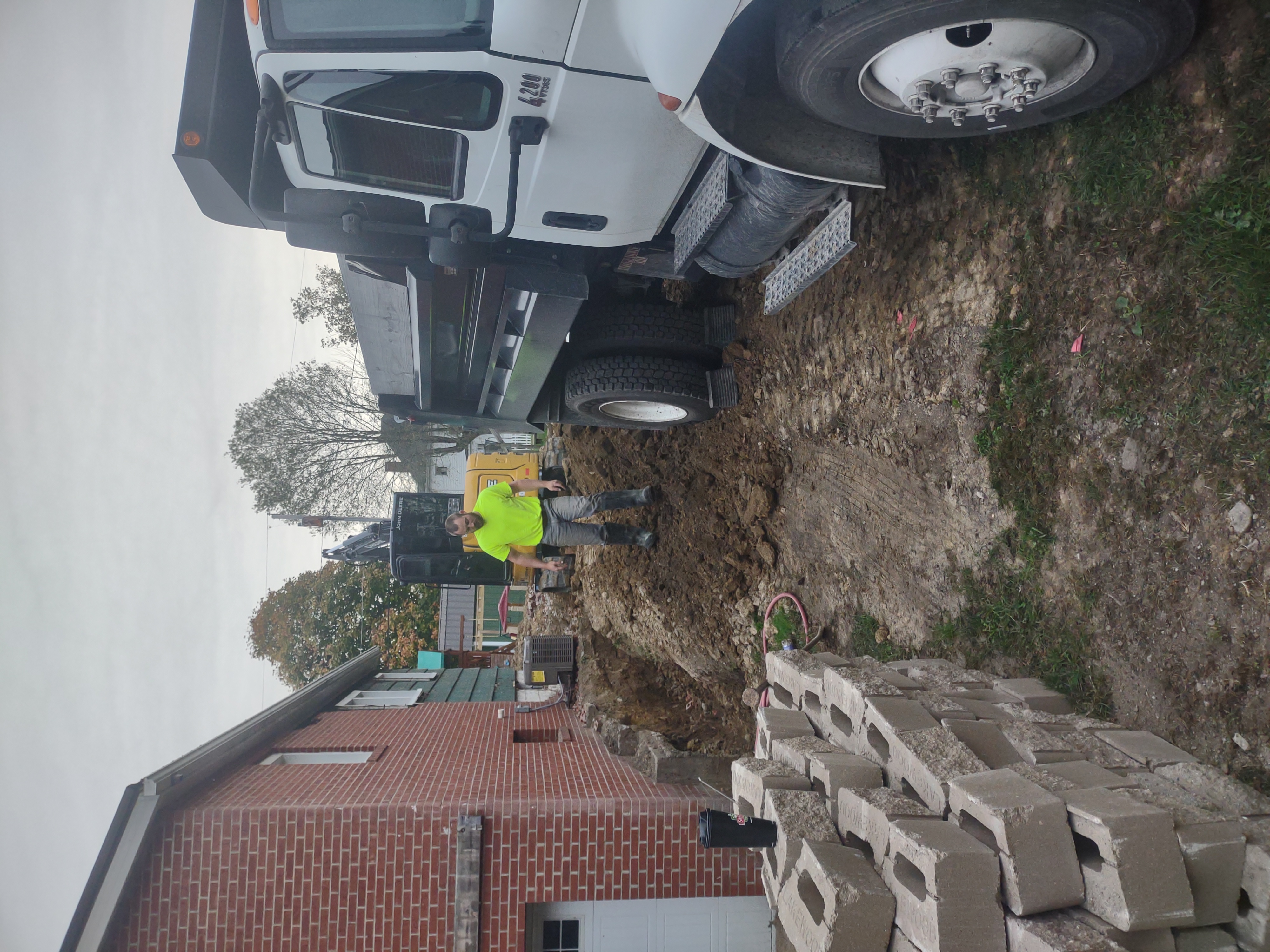 Crew working the excavation with equipment