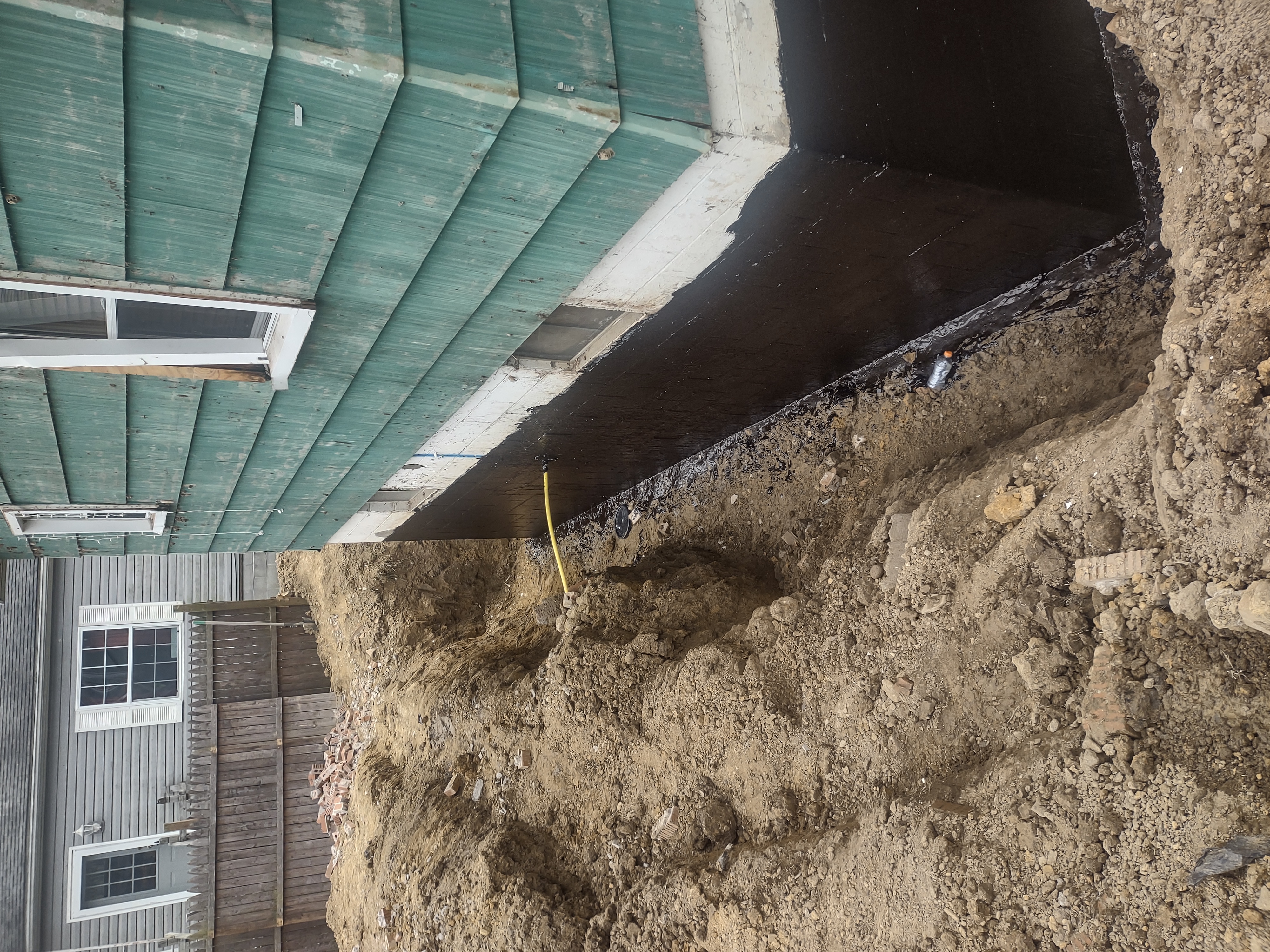 Full waterproofing membrane view with open trench