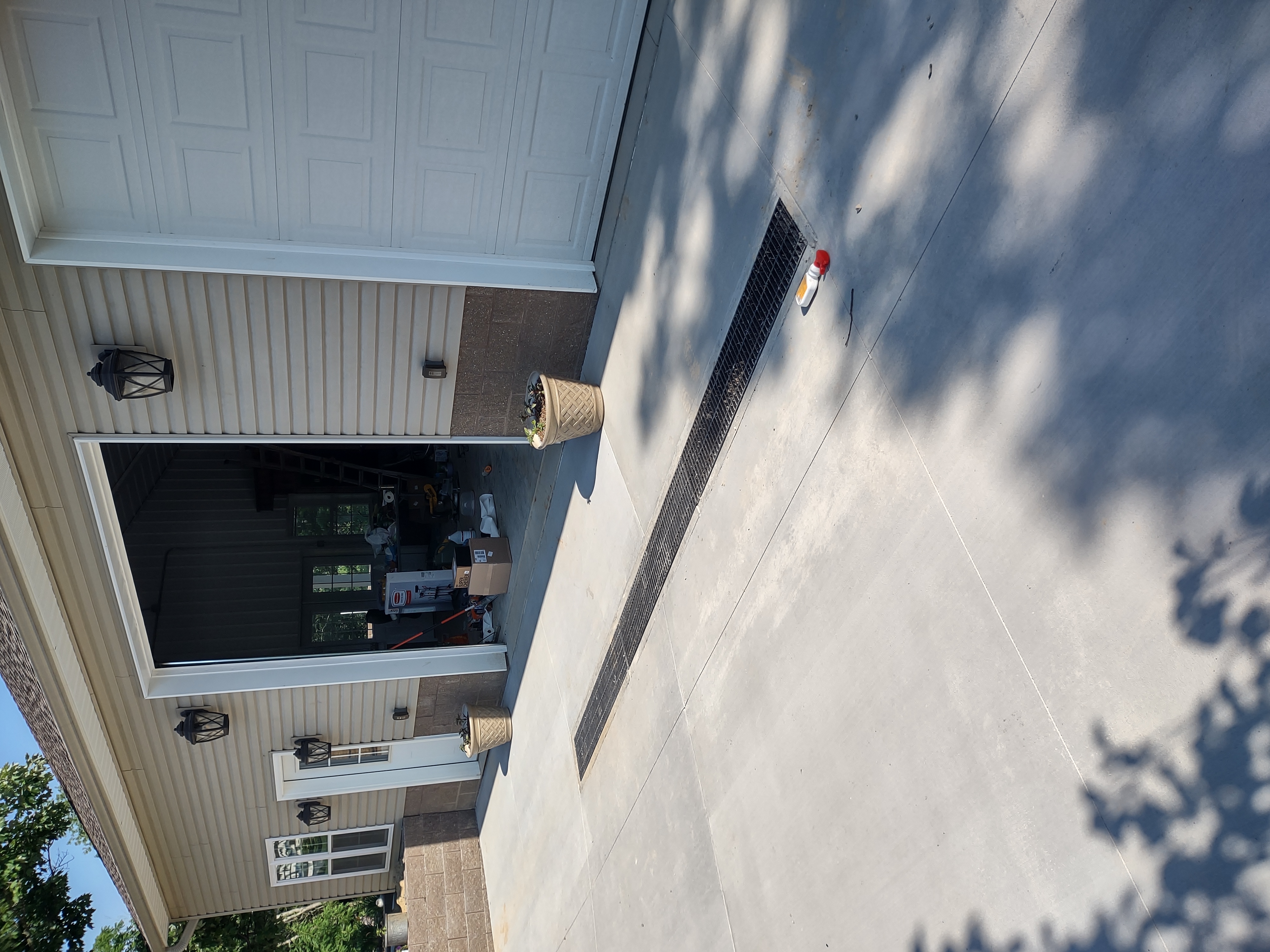 Completed apron at garage with trench drain detail