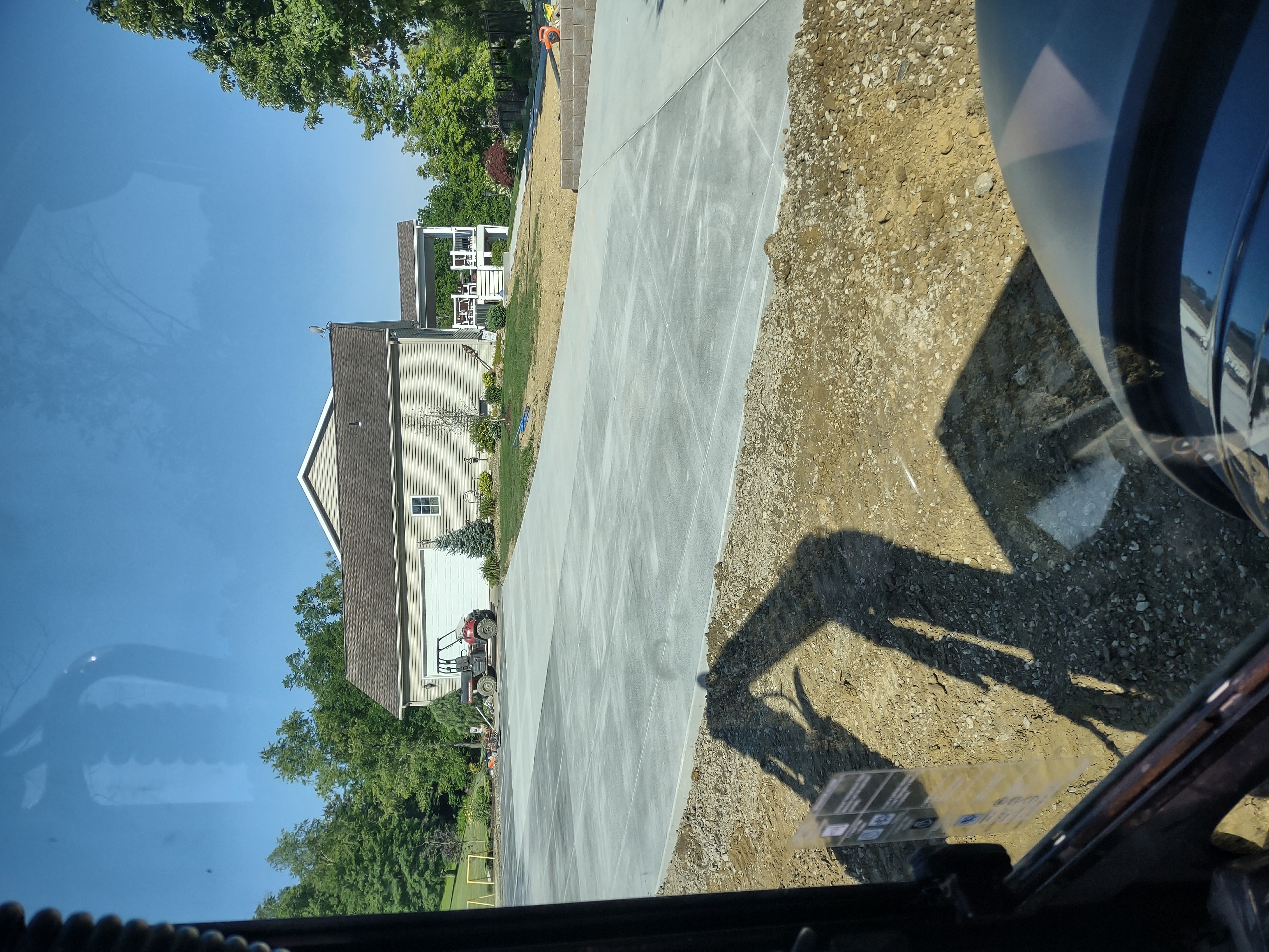 Full driveway sweep toward the home from cab view