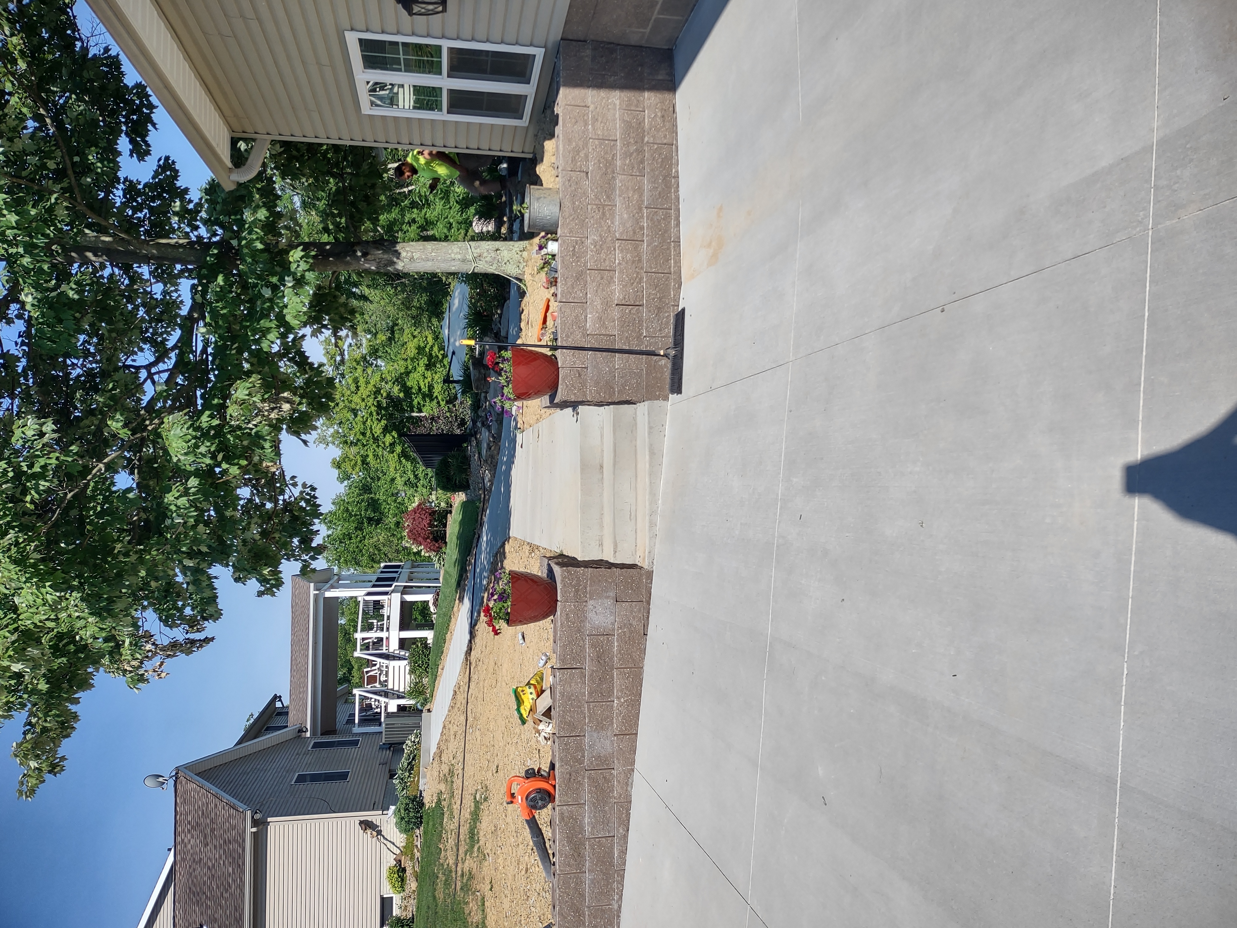 Retaining wall and concrete steps with crew finishing up