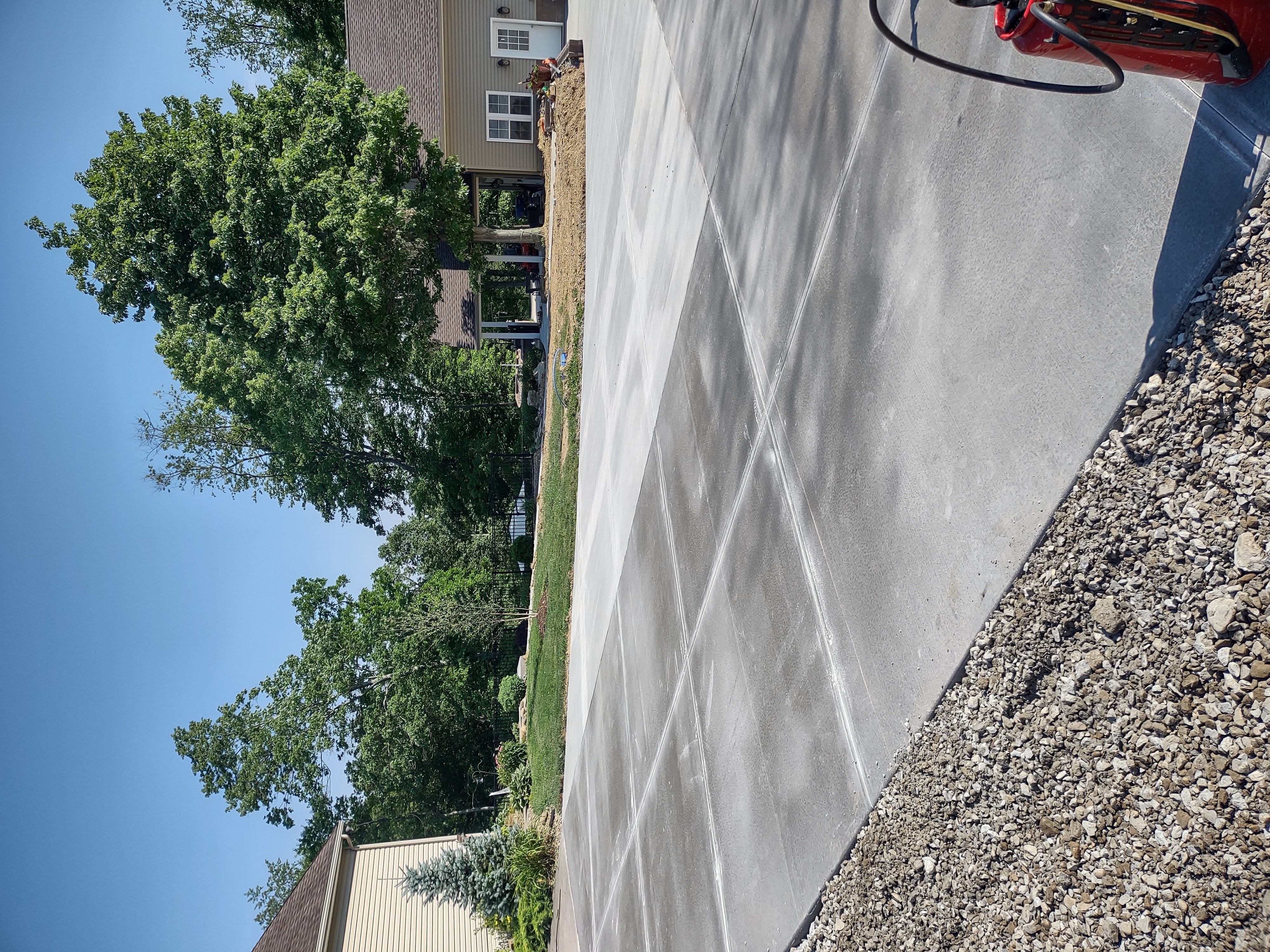 Overhead view of finished driveway slab with control joints