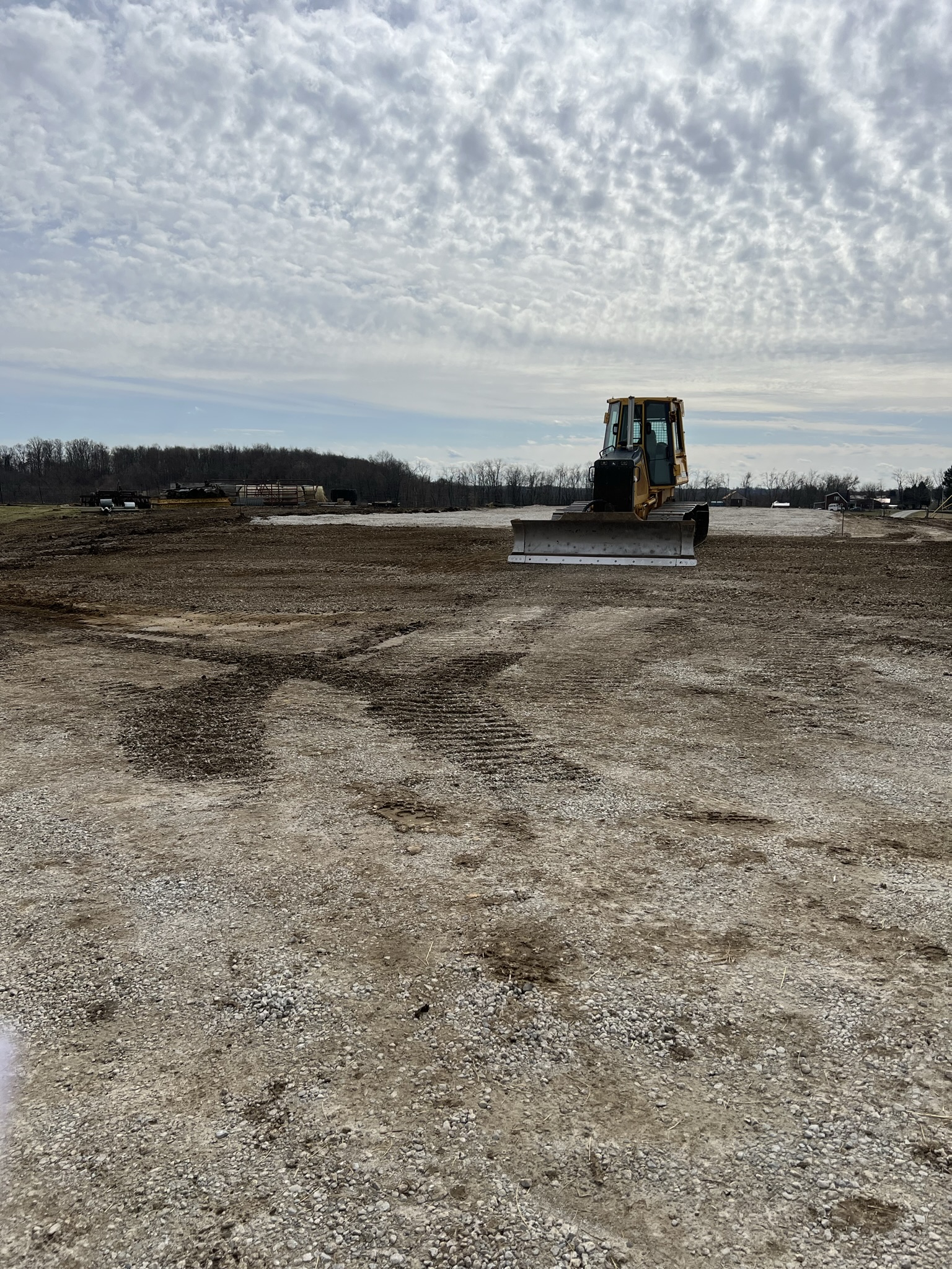Dozer grading the cleared site
