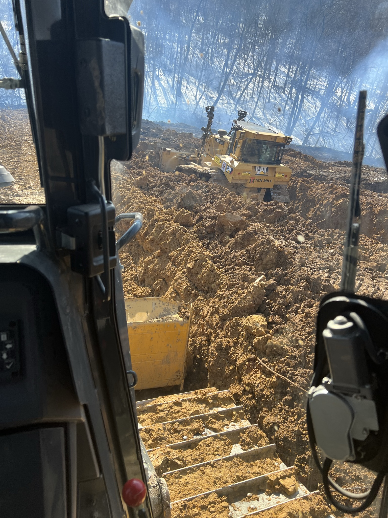 Two dozers working home pad cut simultaneously