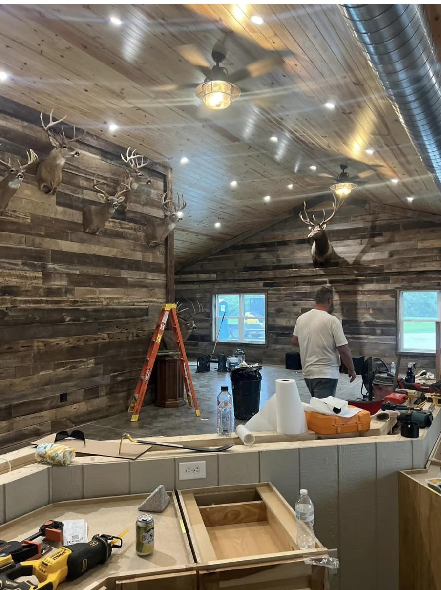 Barn wood interior wall build-out in progress