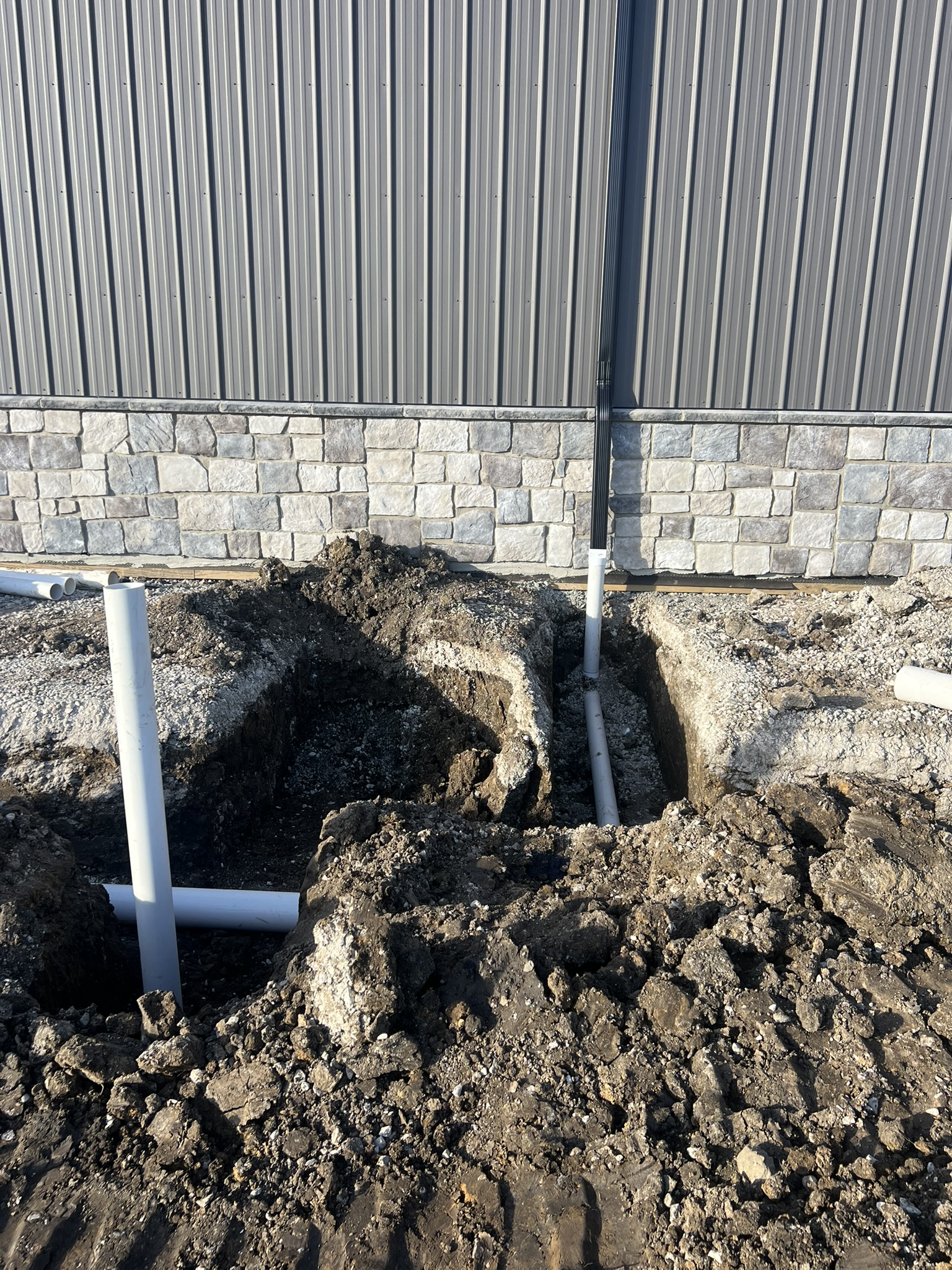 Plumbing stub connections at barn foundation