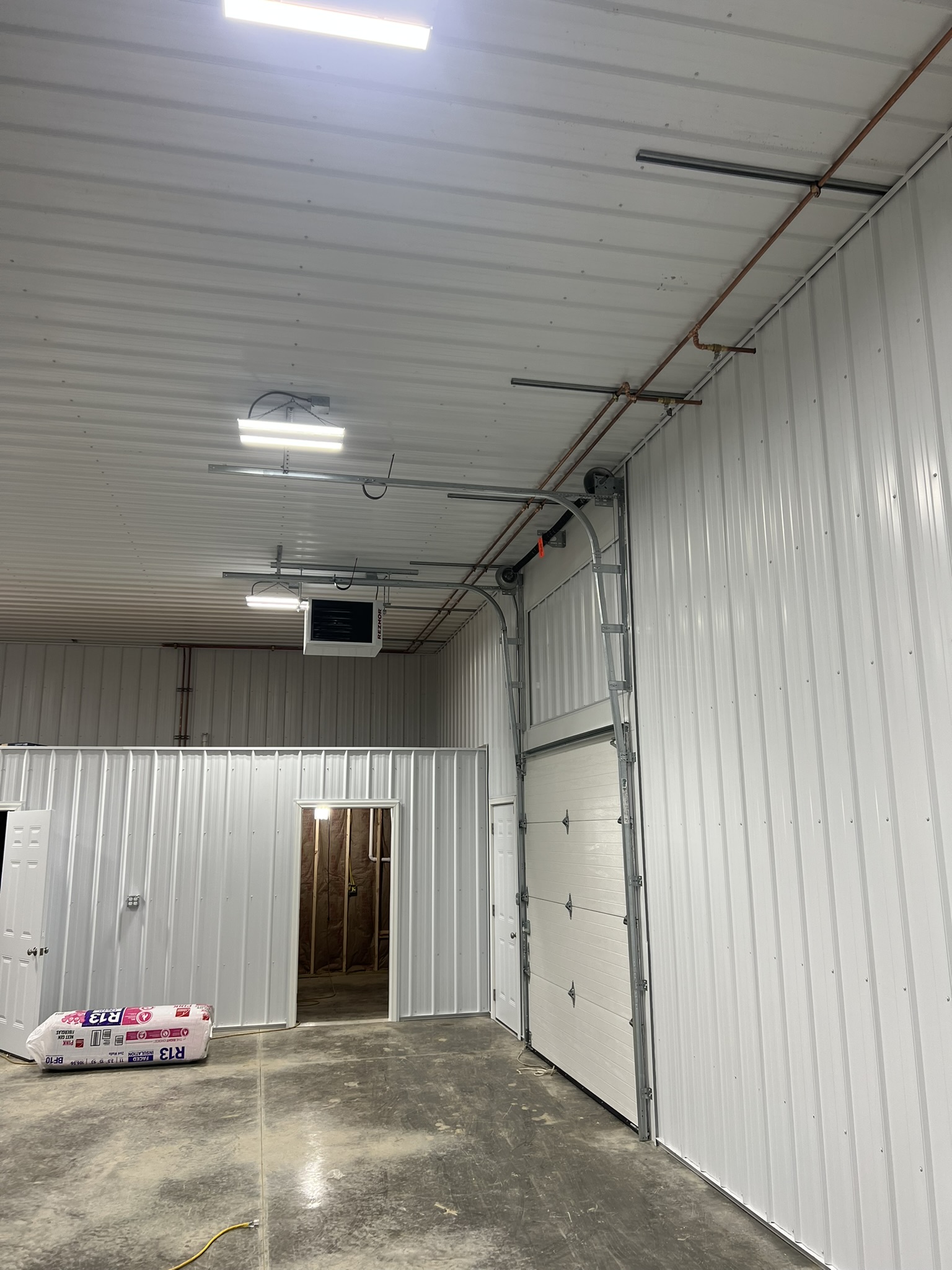 Interior barn garage bay with copper gas lines