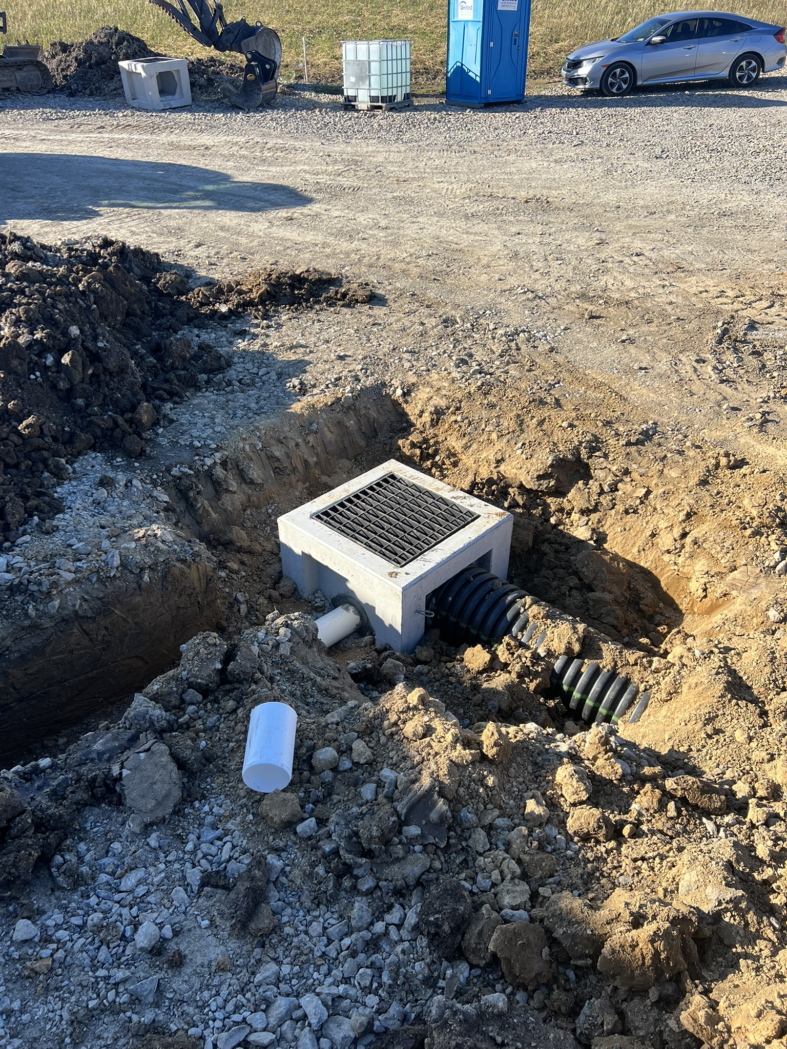 Precast catch basin with HDPE drain pipe installed