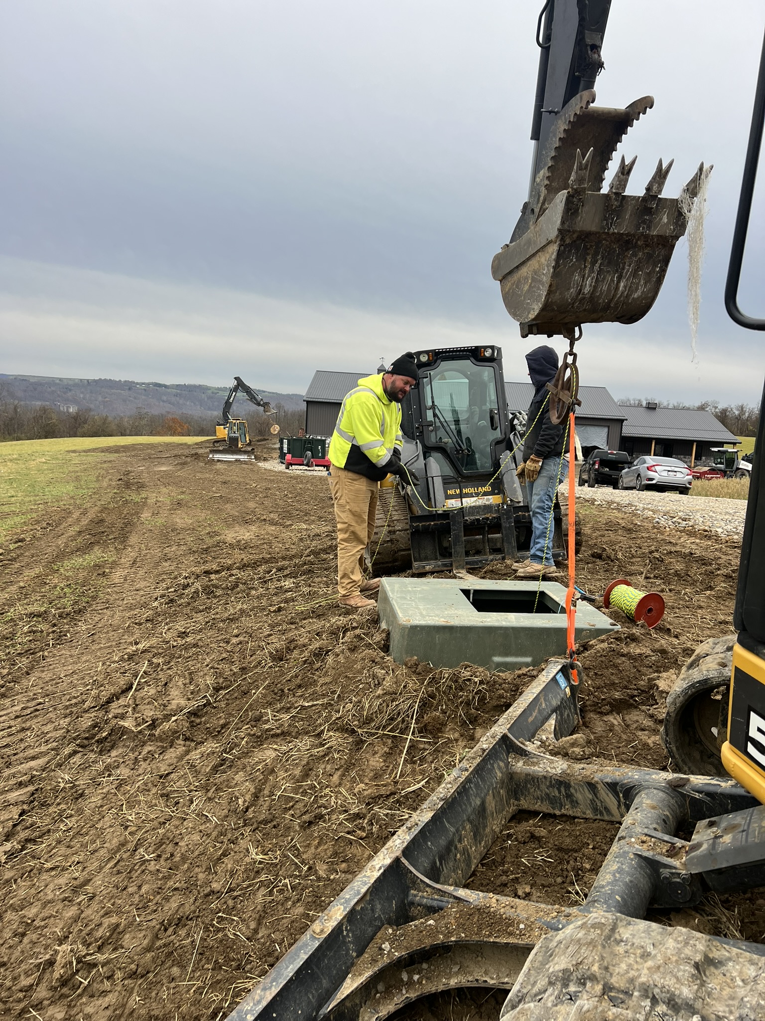 Crew setting precast junction box