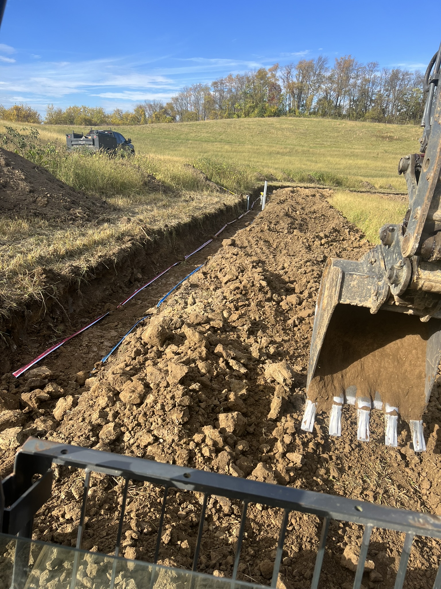 Conduit and water line being backfilled